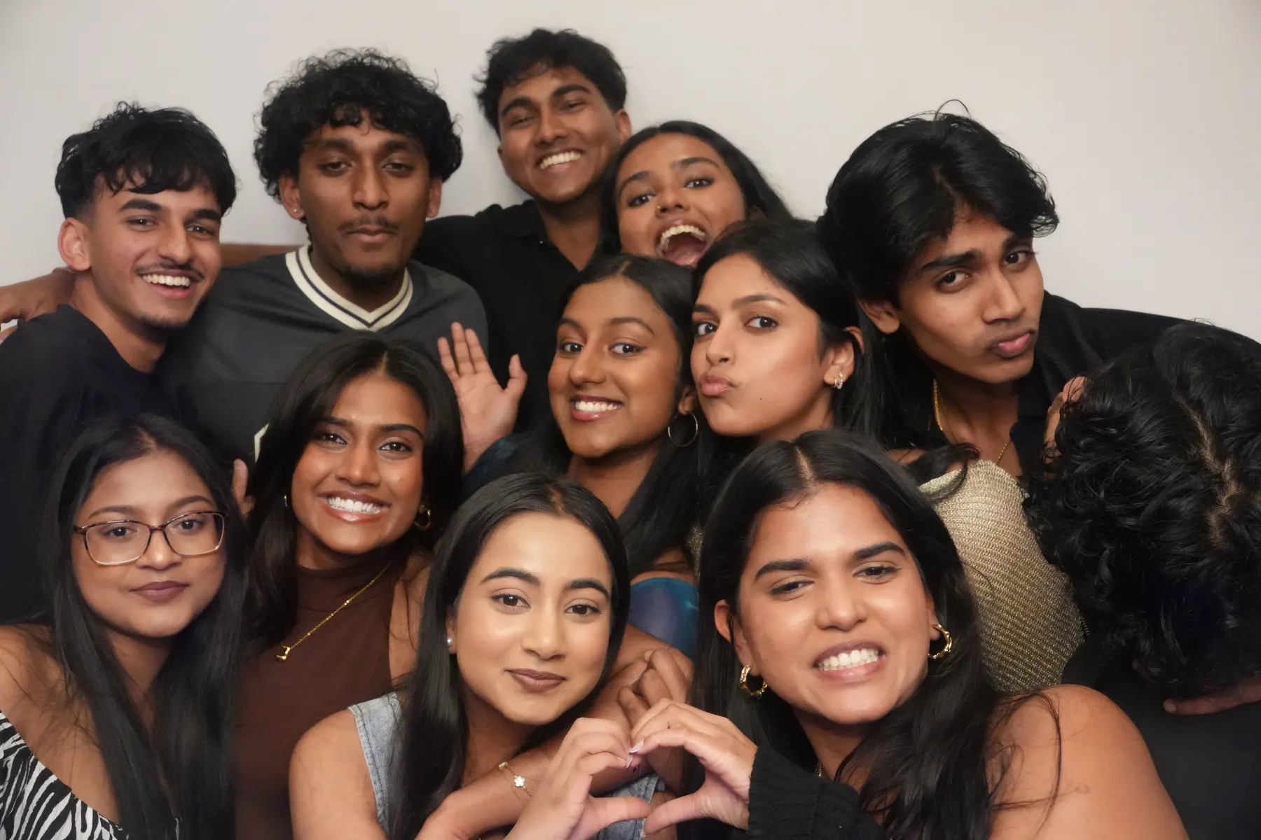 Members crowded together for a photo booth shot at an MSLA event.